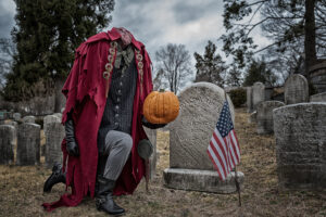 Headless Horseman kneeling at grave of Washington Irving