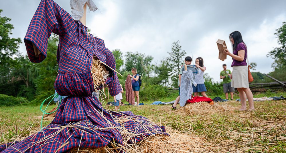 children making scarecrows during Cornucopia celebration at Philipsburg Manor