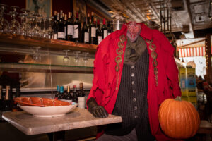 The headless horseman sits at a table at Mint restaurant.