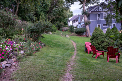 A view of the Old Croton Aqueduct in downtown Tarrytown where it passes through backyards.