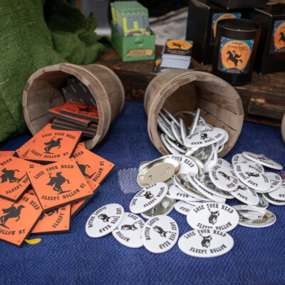 Headless horseman buttons and coasters displayed for sale at the annual Sleepy Hollow Street Fair.