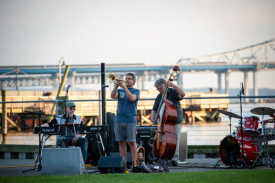 Jazz musicians at Horan's Landing park in Sleepy Hollow, New York, with Mario Cuomo Bridge in background.