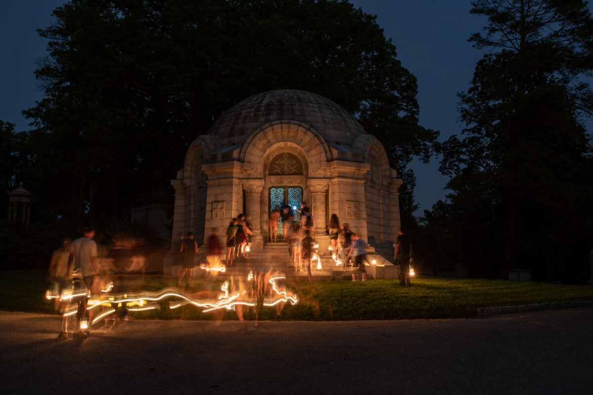 Sleepy Hollow Cemetery tour pauses at the entrance to Archbold mausoleum.