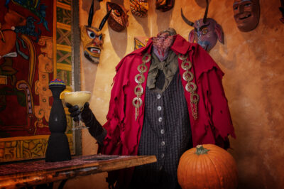 The headless horseman poses with a pumpkin and a margarita at Guadalajara restaurant.