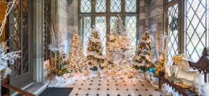 The entry to Lyndhurst mansion is decorated for Christmas with trees ,ribbons and bows.