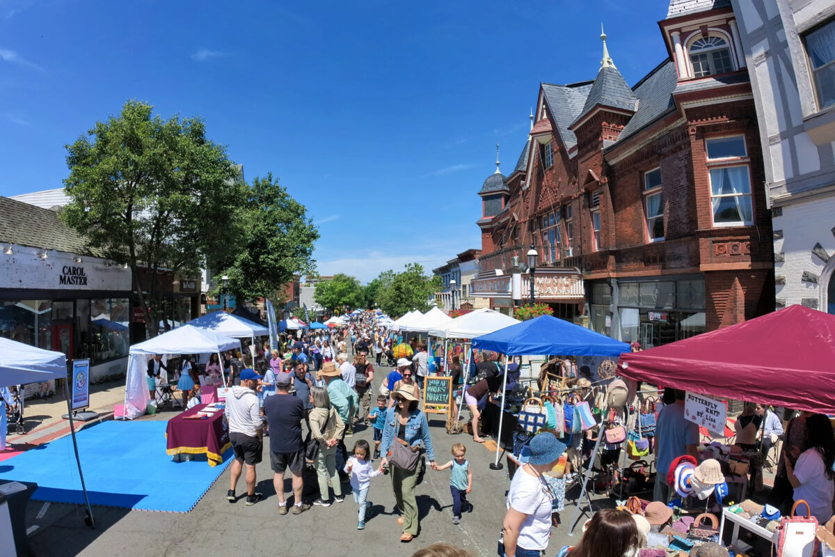 A view of the 2022 Tarrytown Street fair showing vendor tents outside the Music Hall.