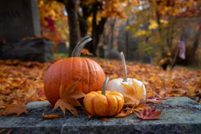 Pumpkins appear on a stone in Sleepy Hollow Cemetery.